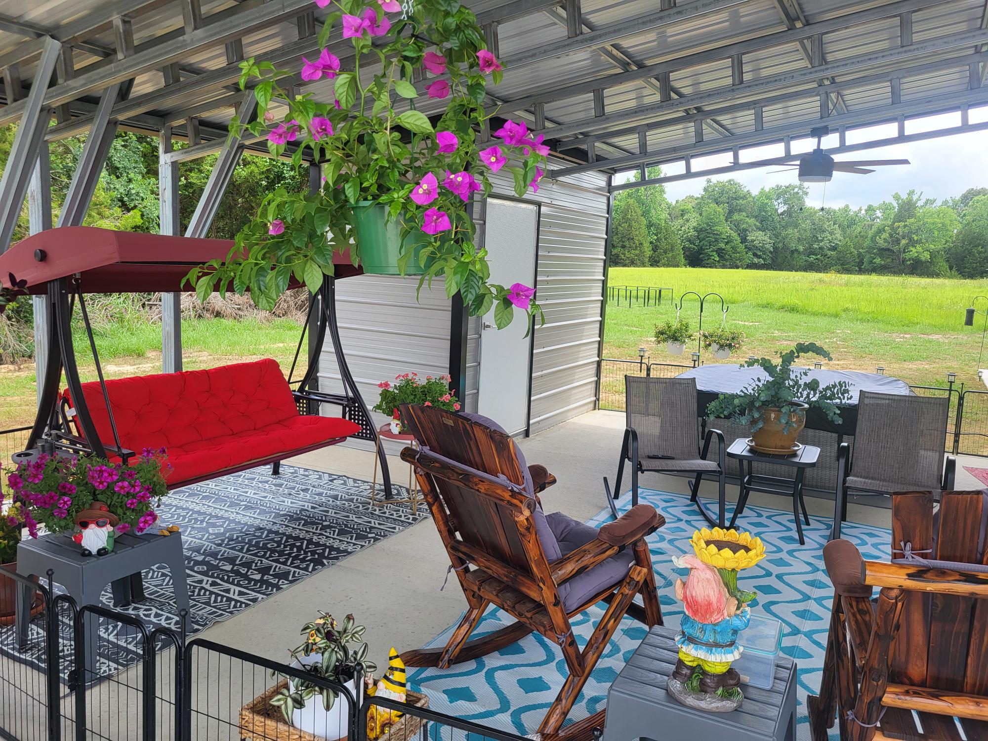 Furnished private carport patio with flowers and outdoor seating