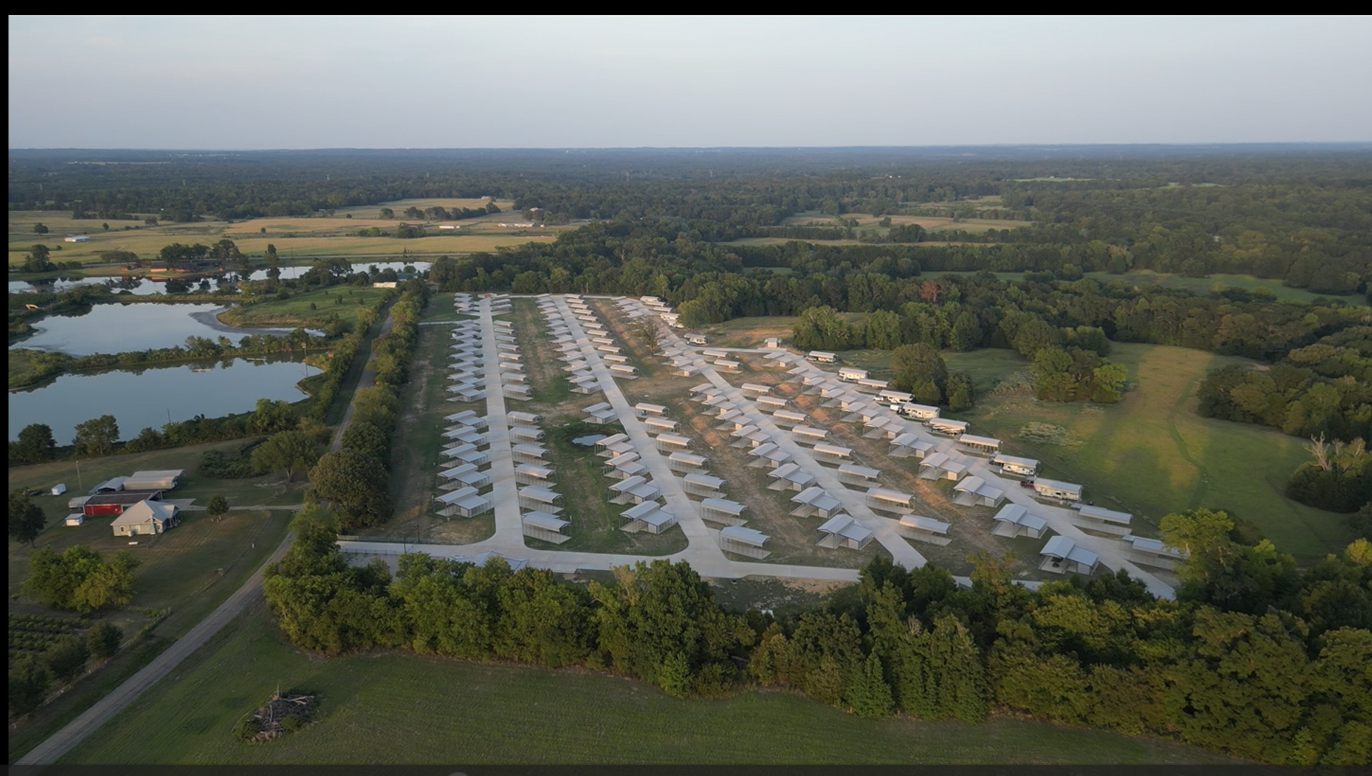 Wide aerial view of 9 Tree RV and the surrounding East Texas countryside